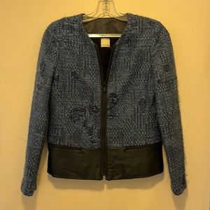Ecru tweed jacket with leather accents.  Pre-owned with no flaws.